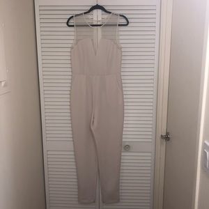 White jumpsuit with mesh accents